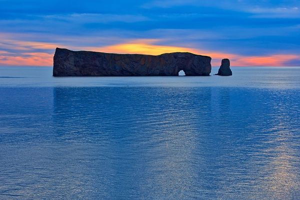 Canada-Quebec-Perce Perce Rock in Atlantic Ocean at sunset